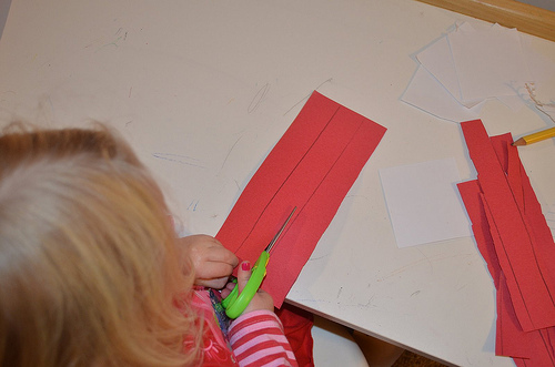 Cutting Paper Strips for Advent Countdown Chains (Photo from The Education of Ours)