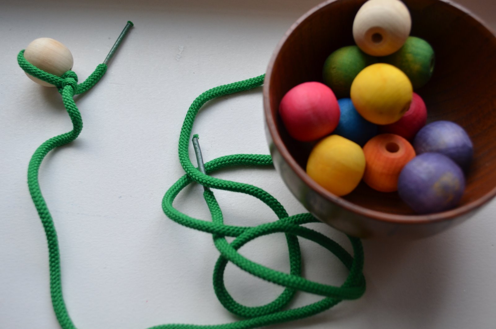 Rainbow Bead Stringing (Photo from The Education of Ours)