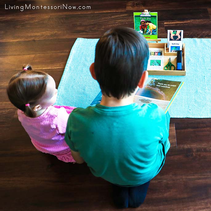 Reading Earth Day Books Before Working with Earth Day Materials with His Little Sister Reading Earth Day Books Before Working with Earth Day Materials with His Little Sister